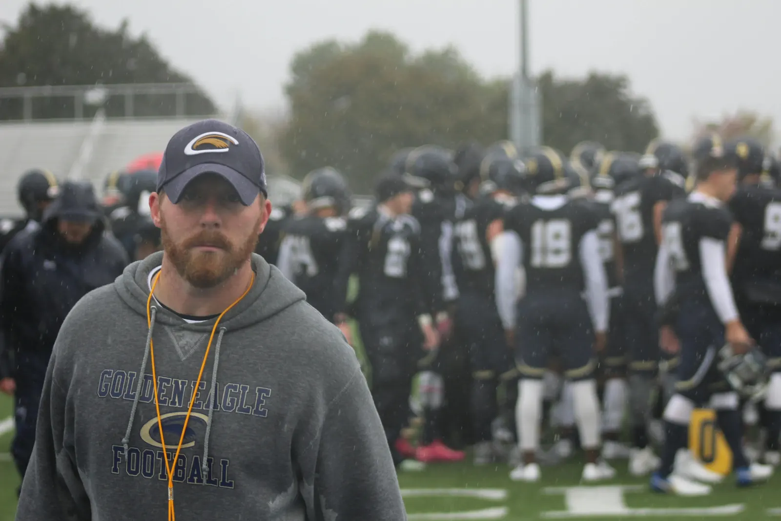 Coach with team members